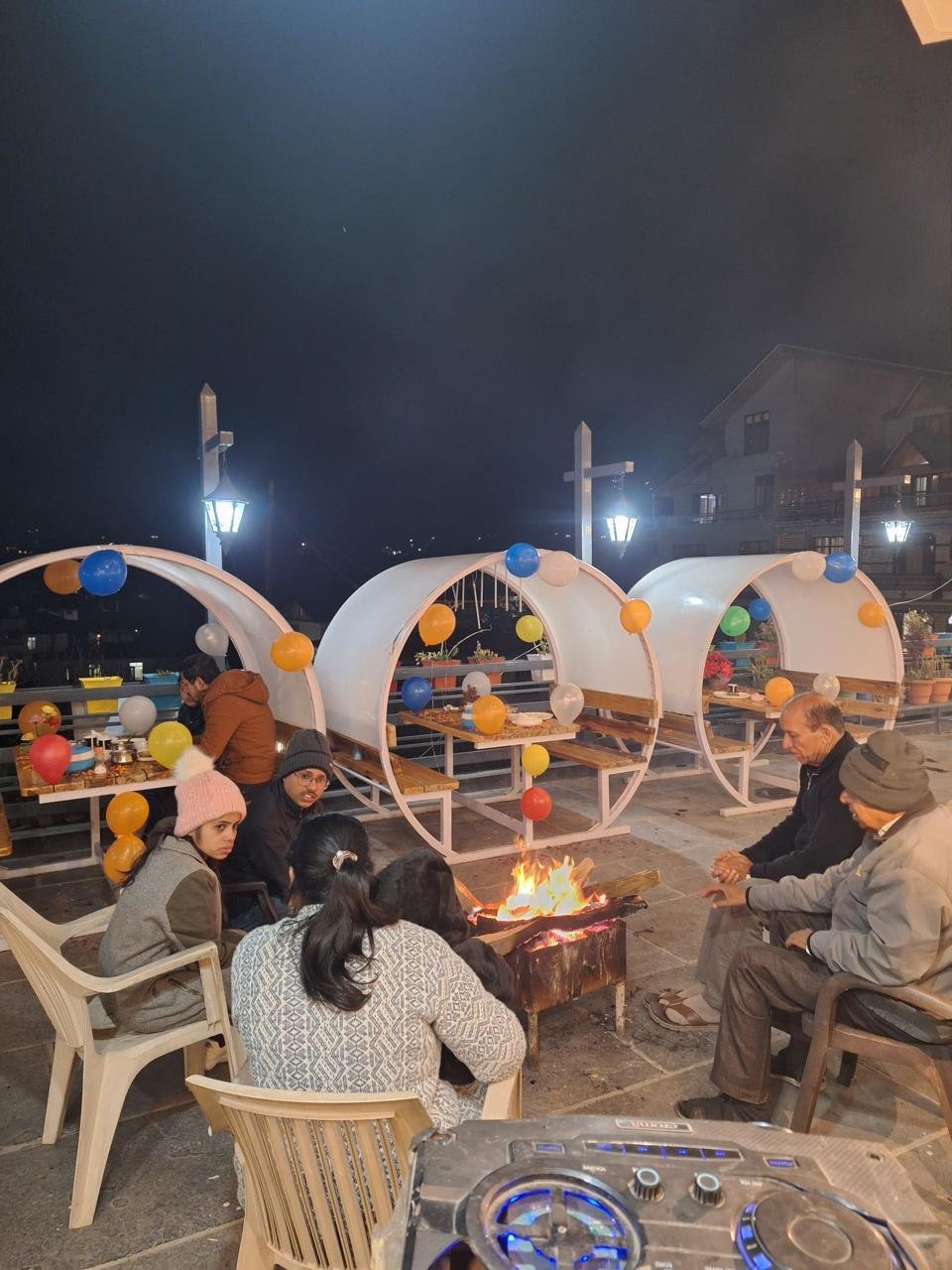 Guests gathered around the bonfire lounge at BTH Hotels & Resorts